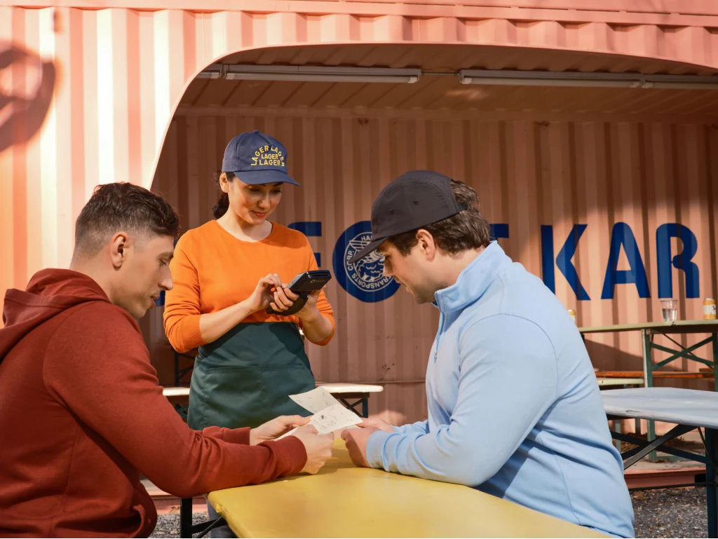 A server taking an order at the table